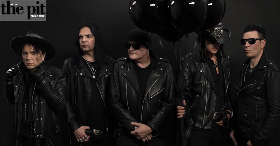 Rock band members in black leather, posing with black balloons against a dark background, with "the pit magazine" logo at the top left.