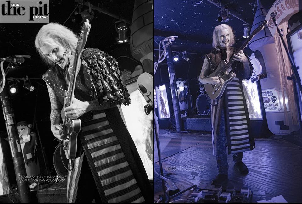 A black-and-white photo collage of John5 performing on stage with an electric guitar, adorned in a striped ensemble, surrounded by vibrant stage lighting.