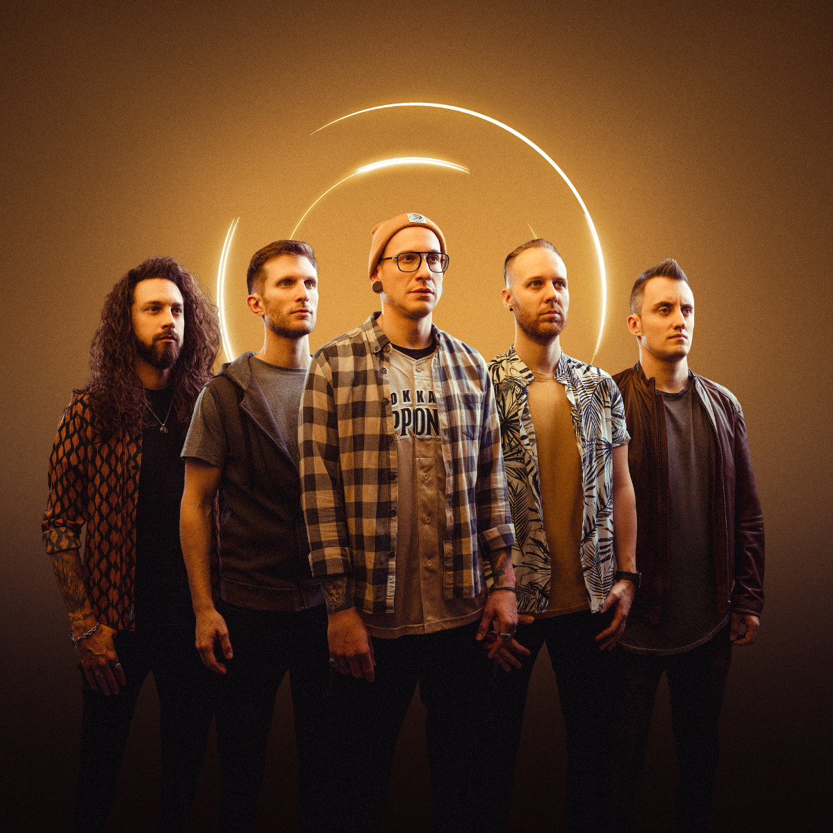 Five men from Dreamshade standing in a group, framed by a neon circular light in the background, looking intently at the camera.